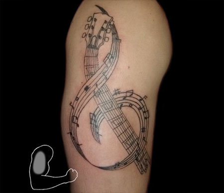 colorful music symbols tattoo