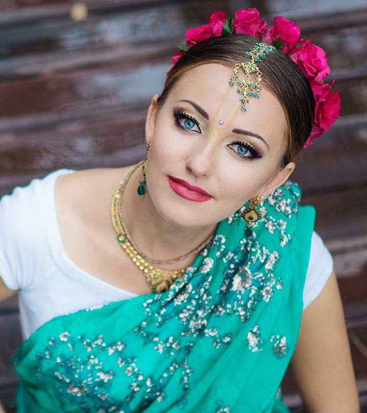 Image of Young Indian lady in ethnic bridal wear, jewelry and  make-up-SE116392-Picxy