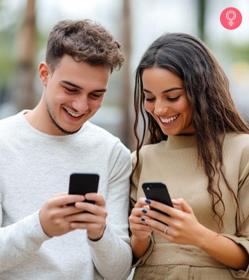 A man and a woman typing messages on their mobiles