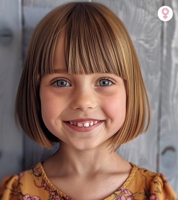 A smiling kid with short hair