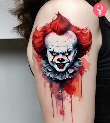 A Pennywise tattoo on the arm of a woman