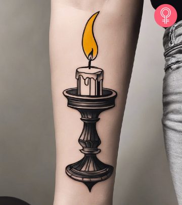 A candle tattoo on the arm