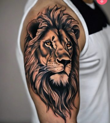 A lion tattoo on a man’s upper arm