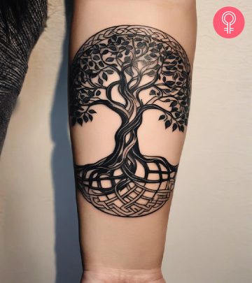 A woman with a Yggdrasil Tattoo on her arm