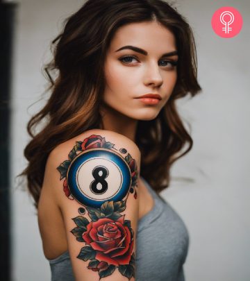 An 8 ball tattoo on the arm