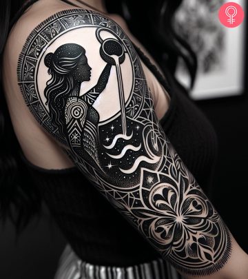 Woman wearing an Aquarius water bearer sleeve tattoo