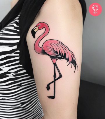 Woman with flamingo tattoo on her arm