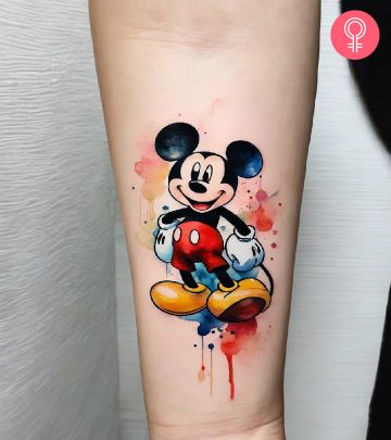 Watercolor Mickey Mouse tattoo on the arm