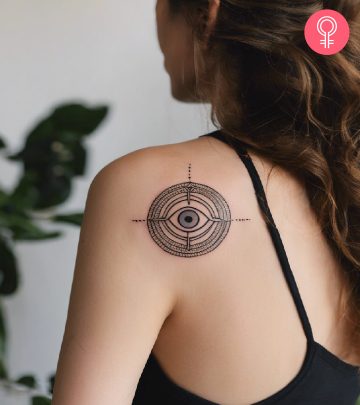 A woman with a third eye tattoo on her shoulder