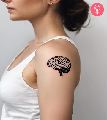 A brain tattoo on a woman’s upper arm