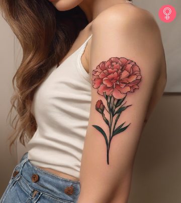 A carnation tattoo on a woman’s arm