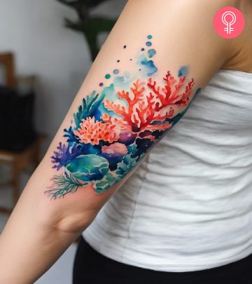 A woman with a coral reef tattoo on her arm