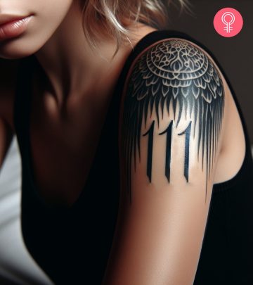 An angel number tattoo on the arm of a woman