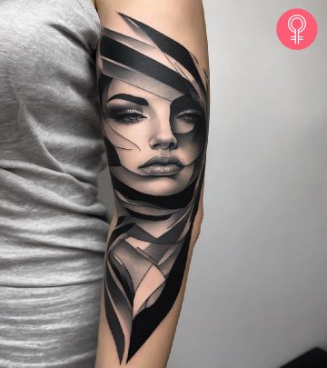 Abstract tattoo on the arm of a woman