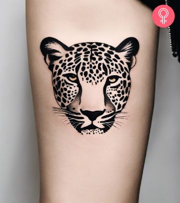 Close up of a leopard tattoo on a woman’s arm