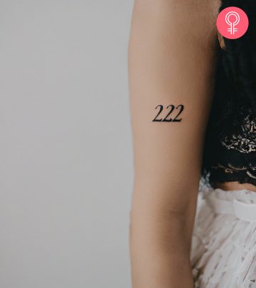Woman with a 222 tattoo on her arm