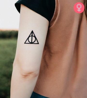 Deathly hallows tattoo on the upper arm