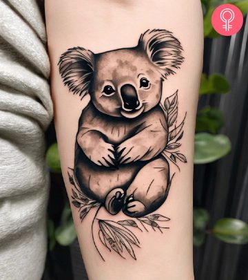 Woman with koala tattoo on her arm