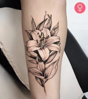Woman with outline lily tattoo on her arm
