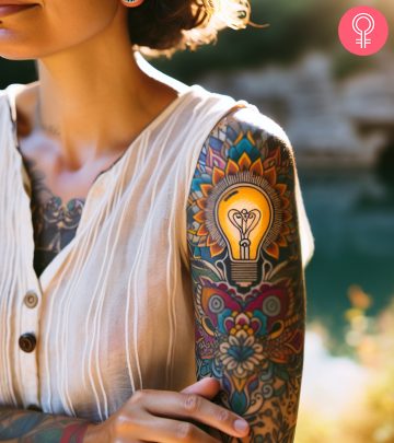 A woman with a lightbulb tattoo on her upper arm