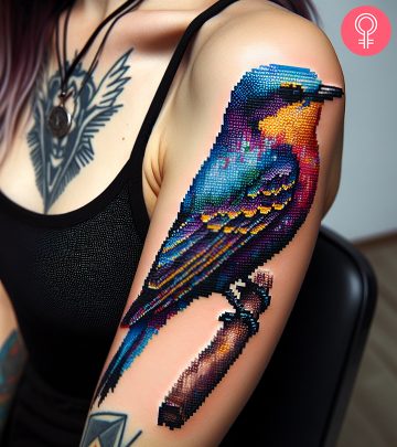 Pixel bird tattoo on a woman’s arm