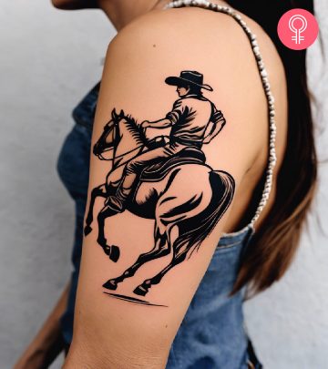 A woman with a western rodeo tattoo on the upper arm.