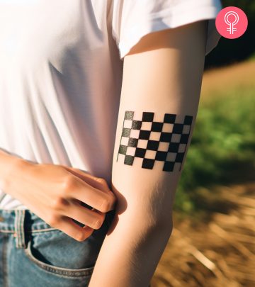 A woman with a checkered flag tattoo on her arm