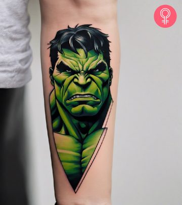 A colored hulk tattoo on the forearm of a woman