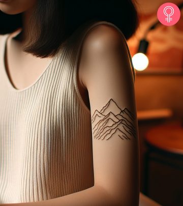 A range of mountains tattoo on the upper arm