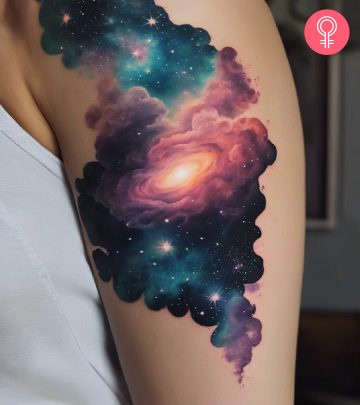 Nebula tattoo on the upper arm