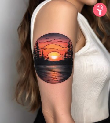 A sunset tattoo on the upper arm