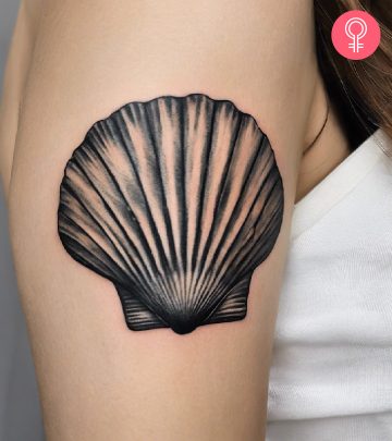 A Camino tattoo on a woman’s upper arm