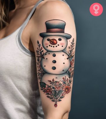A woman with a snowman tattoo on her upper arm