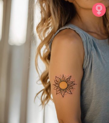Sunshine tattoo on the arm of a woman
