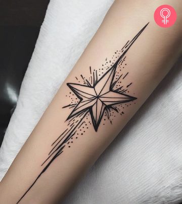 Woman with a shooting star tattoo on her arm