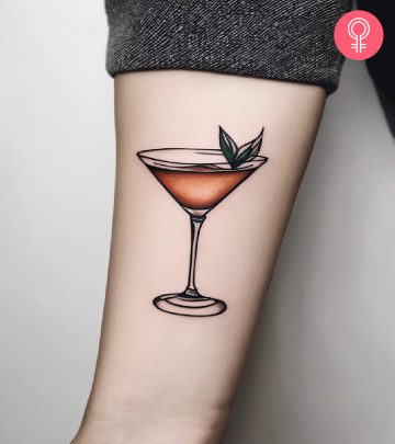 A woman sporting a cocktail tattoo on the forearm