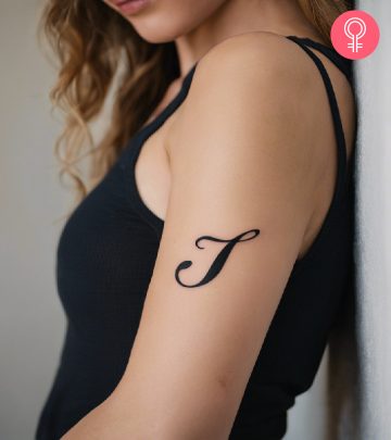 A woman with a letter J tattoo on her arm