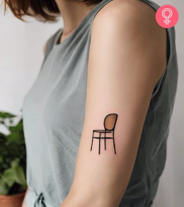 Woman with chair tattoo on her arm
