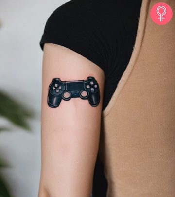 PlayStation tattoo on a woman’s upper arm