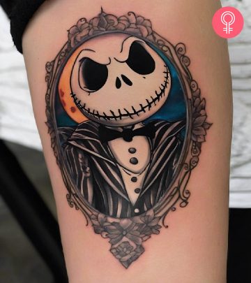 A Jack Skellington tattoo on the arm of a woman