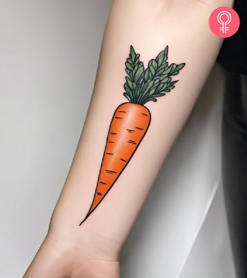 A colorful carrot tattoo inked on the forearm