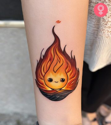 A cute and blaring Calcifer tattoo on the forearm