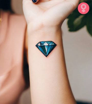 A diamond tattoo on the woman’s wrist