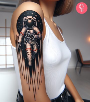 A graphic tattoo on a woman’s upper arm