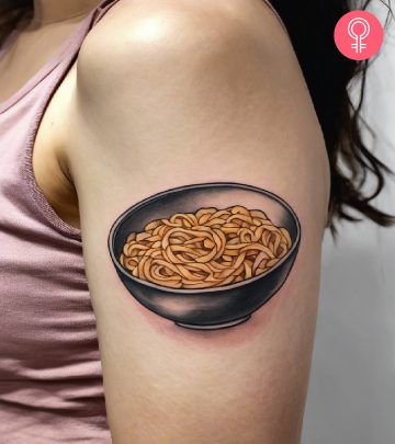 A pasta tattoo on a woman’s upper