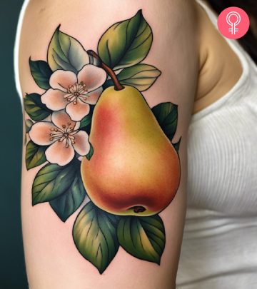 A pear tattoo on the upper arm