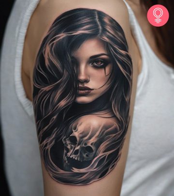 A scary girl with a skull tattoo on the upper arm
