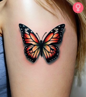 A shadow tattoo on a woman’s upper arm
