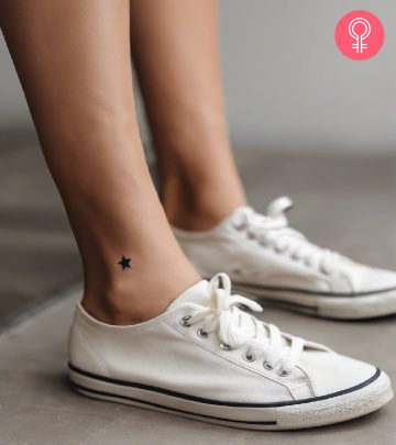 A woman wearing an ankle foot tattoo