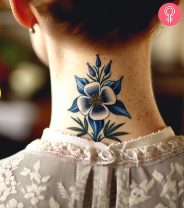 A woman with a Columbine flower tattoo on her neck